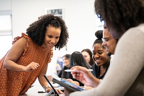 instructor interacting with students during class