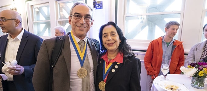 Two distinguished faculty appointees with their medallions