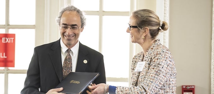 Amanda Godley awarding Daniel Mosse