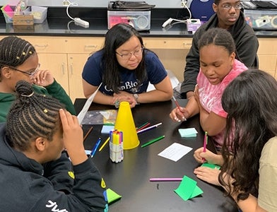 students participating in tabletop activity during Camp Bio