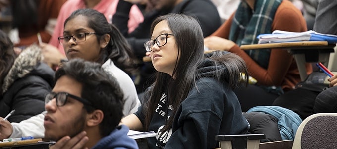 students attending chemistry class lecture