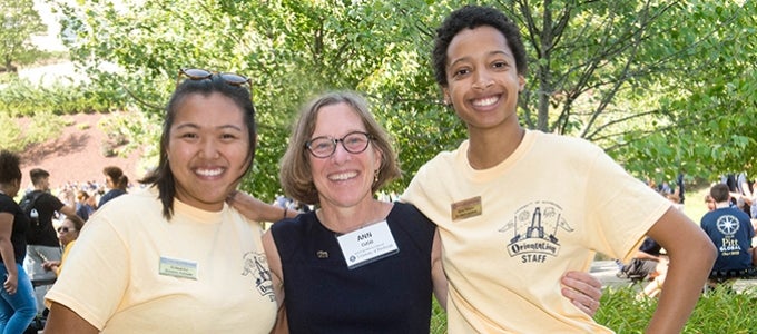 Provost Cudd with two students working as orientation staff