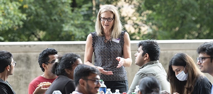 Vice Provost Amanda Godley speaking with students at Graduate Global Mentors picnic