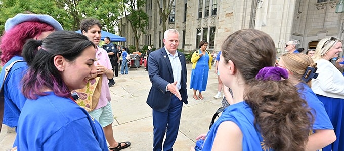 Interim Provost Joe McCarthy meeting students at Pitt's Honors College picnic