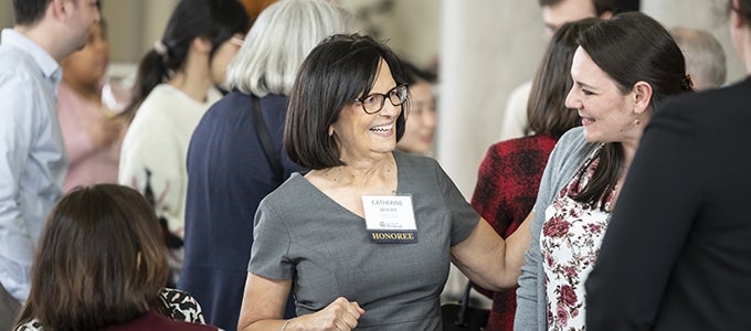 Doctoral Mentoring Award Honoree mingles at recognition reception