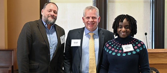 Provost McCarthy poses with two Provost Award winners during recognition event.