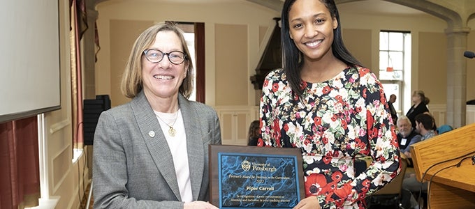 Piper Carroll receives Provost's Award for Diversity in the Curriculum from Provost Ann Cudd