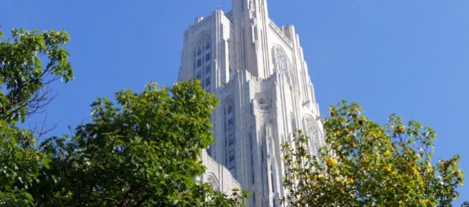 Top of Cathedral of Learning against blue sky