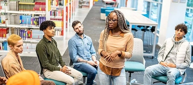 group gathered for conversation in library