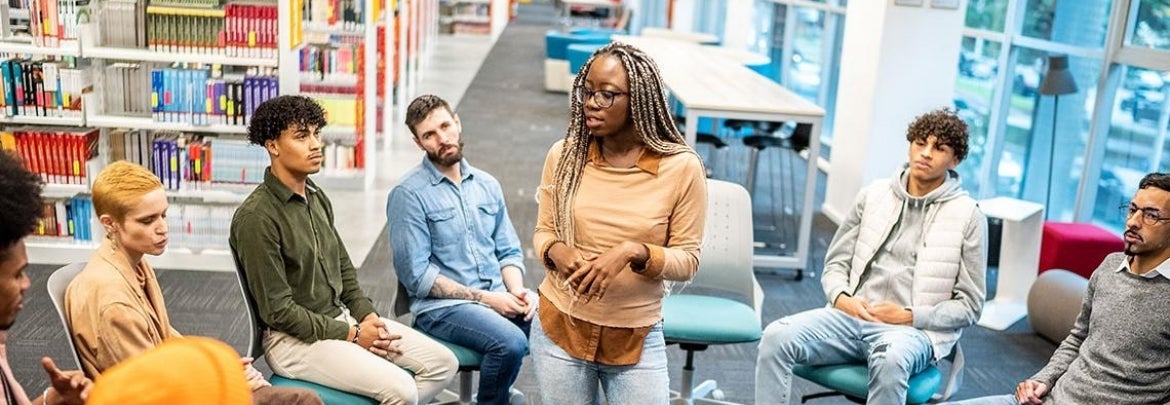 students gathered in a circle engaging in conversation