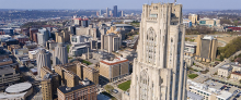 drone's-eye view of Pitt campus with city of Pittsburgh in background